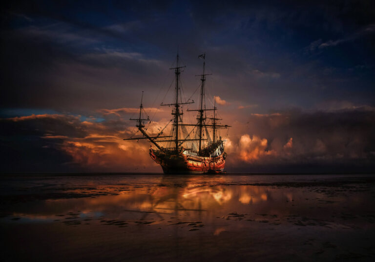 Photograph of a pirate ship at sea by Zoltan Tasi on Unsplash.